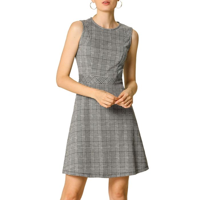 model wearing a sleeveless mini gray plaid dress