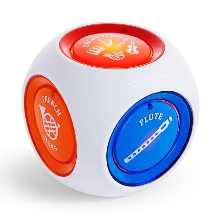 A white music cube with colorful instrument buttons on all sides.