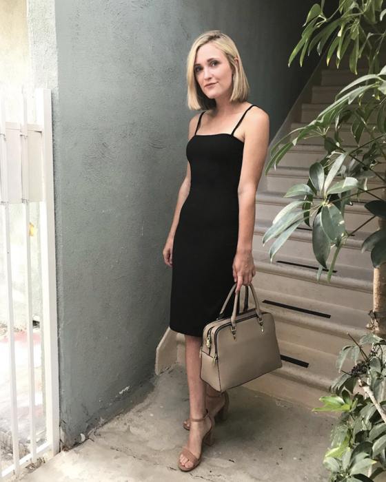 Another reviewer is seen wearing the black version of the dress with heels.