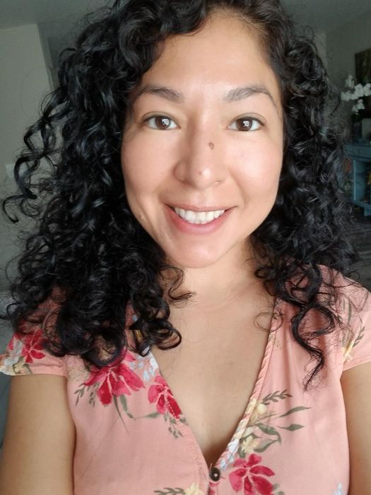 A reviewer’s curly hair dried with the diffuser, showcasing the results