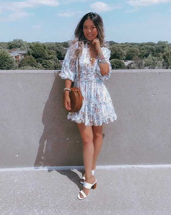 Another reviewer styling the ruffle dress with white sandal pumps.