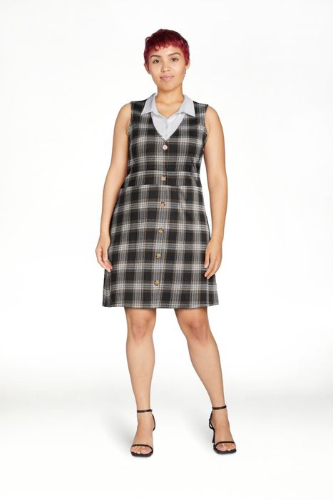 a model wearing the dress in a classic black hue