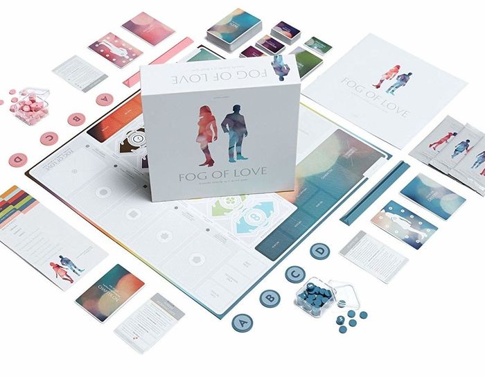 The Fog of Love board game set with cards, tokens, and player boards neatly arranged for display. Featured in a shopping guide
