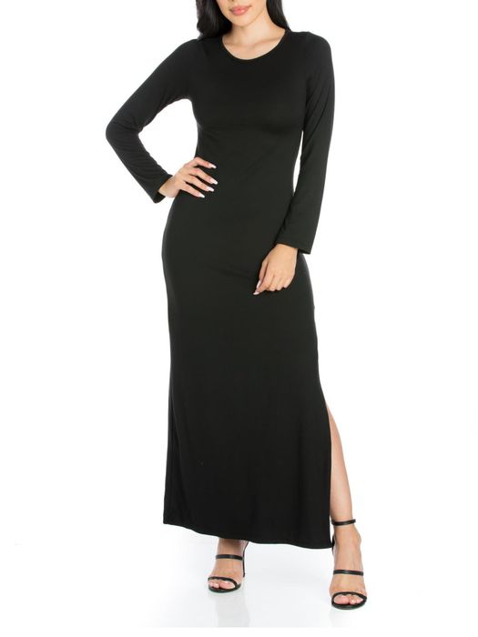 Model showing off a black dress paired with black heels