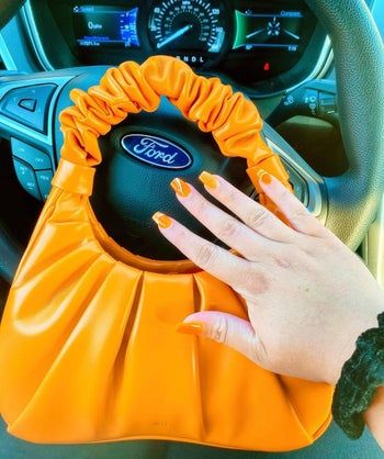Mytour editor's orange handbag