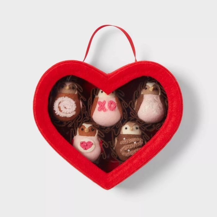 A heart-shaped gift box filled with five adorable owl plush toys, each with a unique design. Perfect for gifting or as a charming decoration.