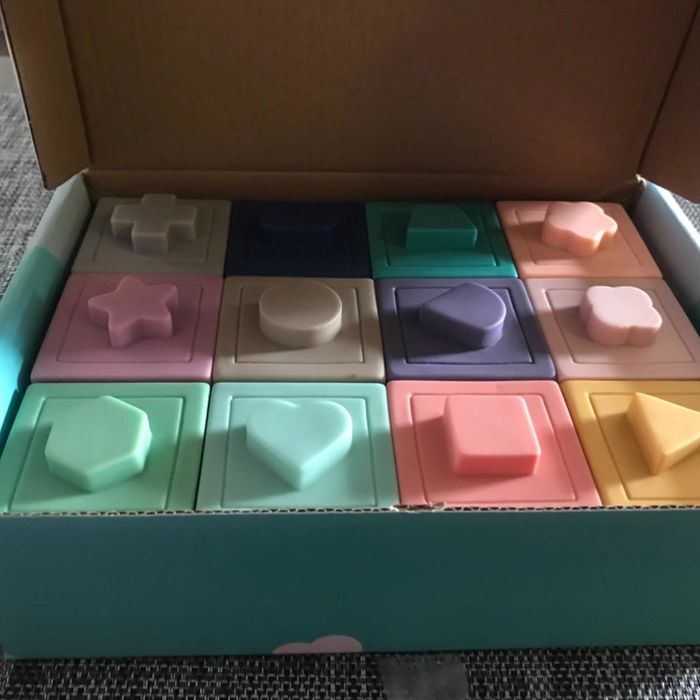 The pastel-colored blocks inside their packaging.