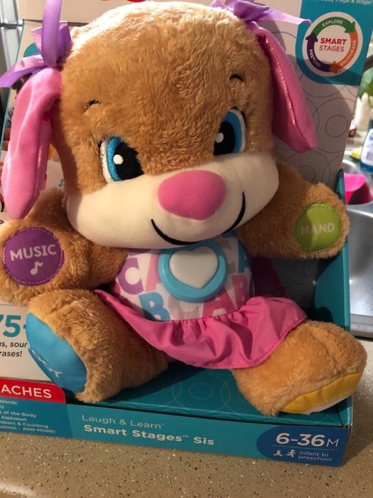 A reviewer's photo of their little one (Sis) enjoying the toy.