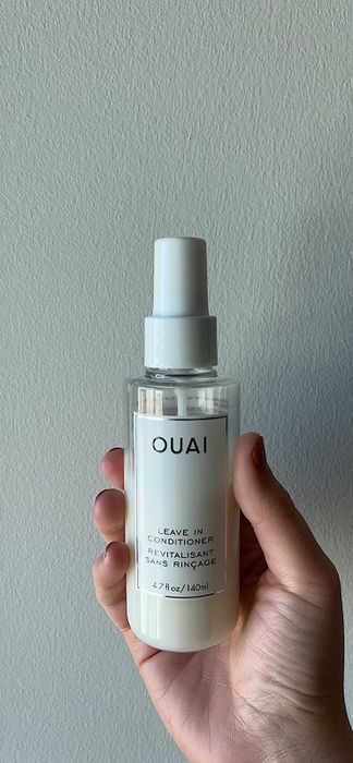 Reviewer holding the spray bottle