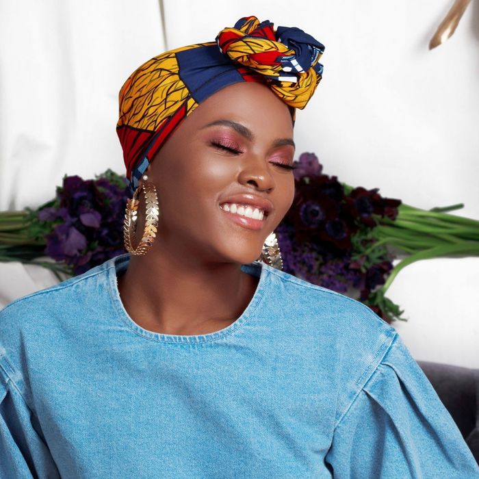 A model wearing the stylish Amina Shortie head wrap