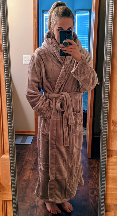 A reviewer models the soft mauve robe, looking cozy and chic in this perfect loungewear piece