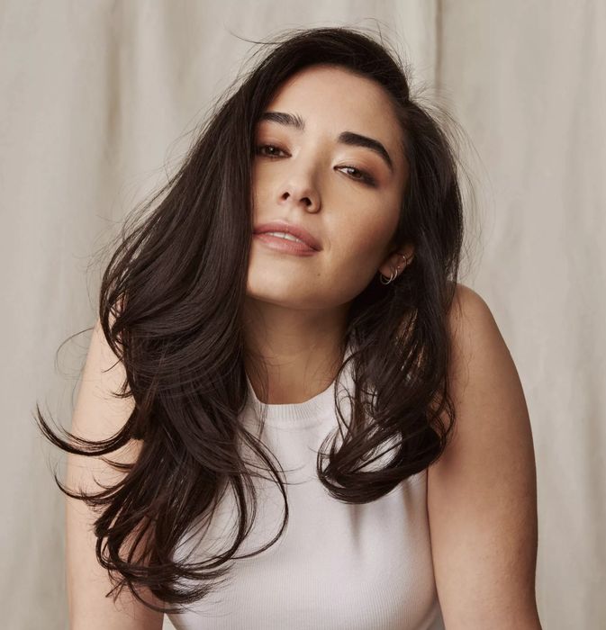 a model showcasing the dry shampoo in their hair
