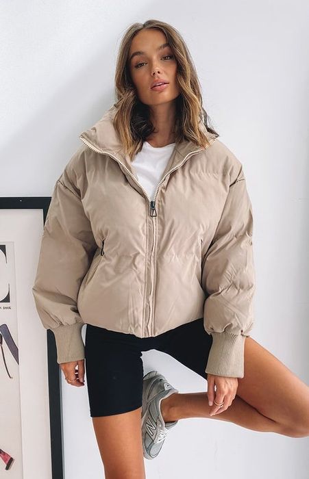 another model dressed in beige