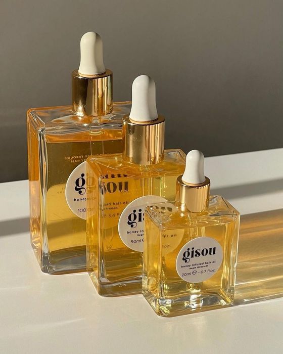 A lineup of the three available bottle sizes for the Gisou oil