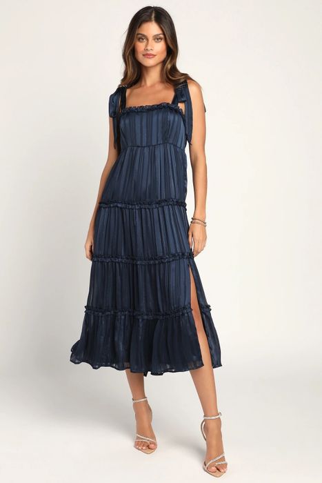 Model wearing a blue dress
