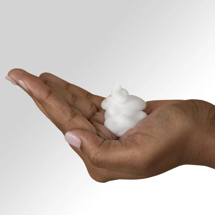 A model holding the product in their hand