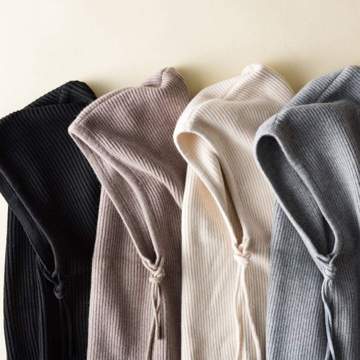 A set of four hoods in various neutral shades.