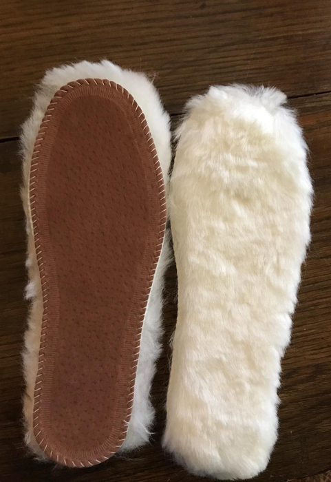 The front and back view of the plush, furry insoles.