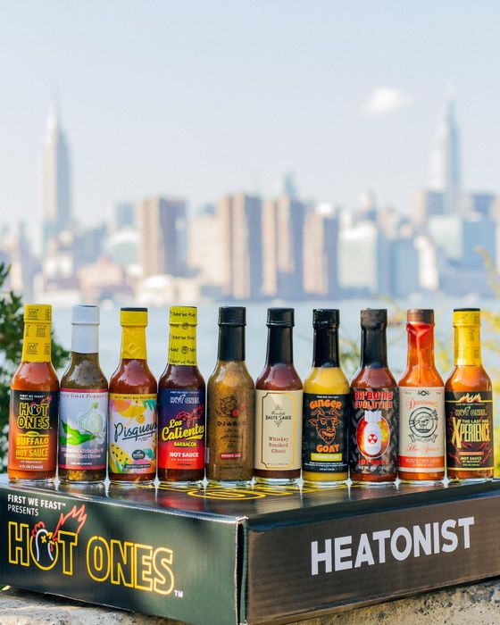 10 hot sauces lined up in a row