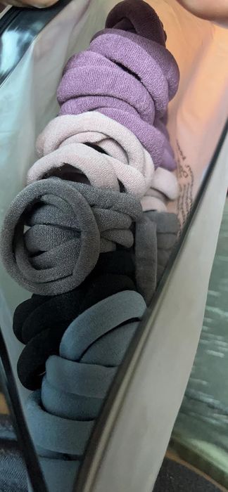 reviewer photo showcasing the hair tie set in its plastic packaging