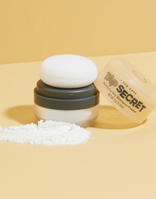 The powder bottle and puff applicator