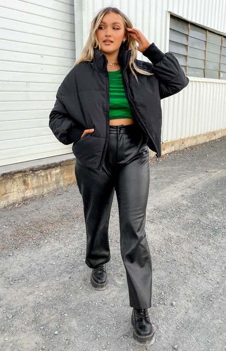 a model wearing the black jacket