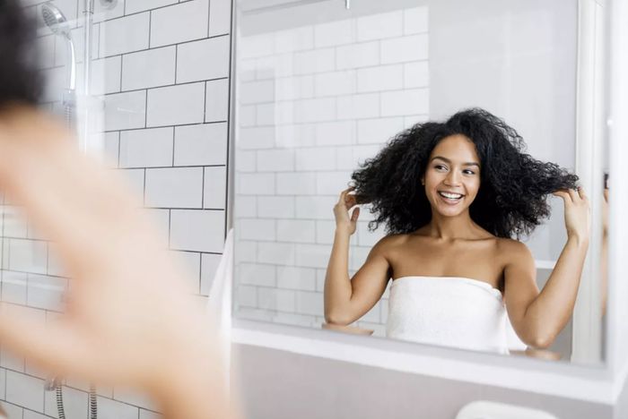 a model showcasing their clean hair after using the shampoo