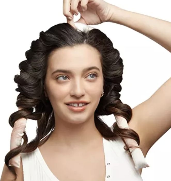 a model wearing the heatless curling set in their hair