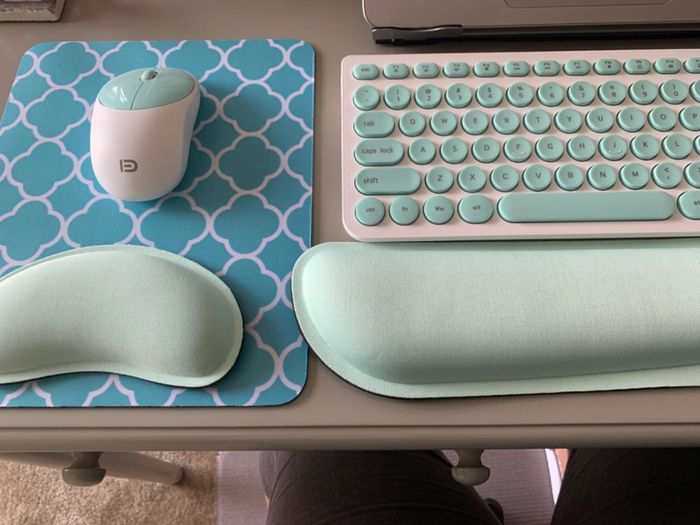 Reviewer photo of the light green gel pads placed in front of a mouse and keyboard