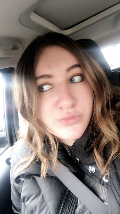 Mytour Editor Sam Wieder showing off wavy curls after using the curling bar