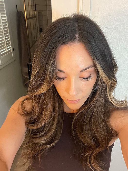 The same reviewer's hair after using the oil, now visibly transformed and radiant.