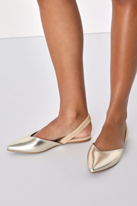 A pair of shiny gold flats.
