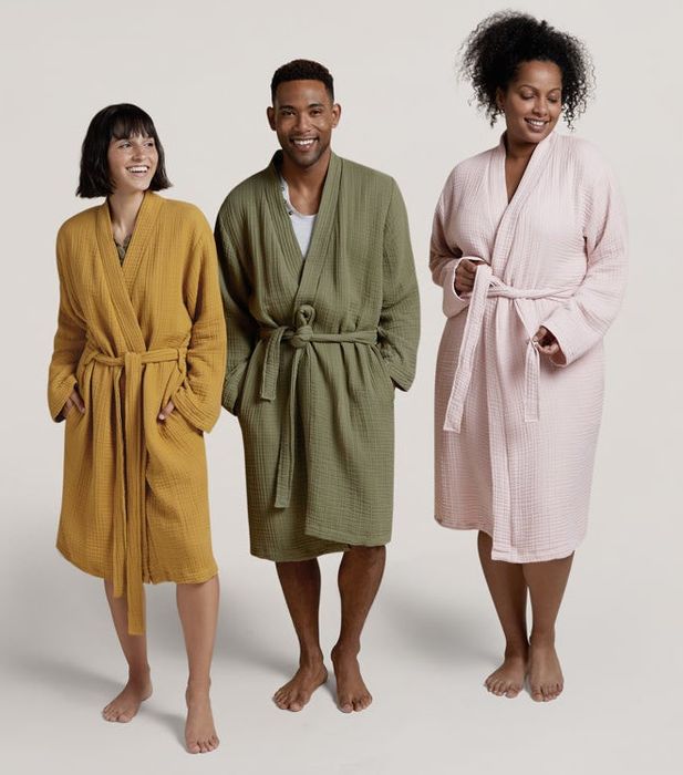 three models showcasing the robe in shades of mustard, green, and soft pink