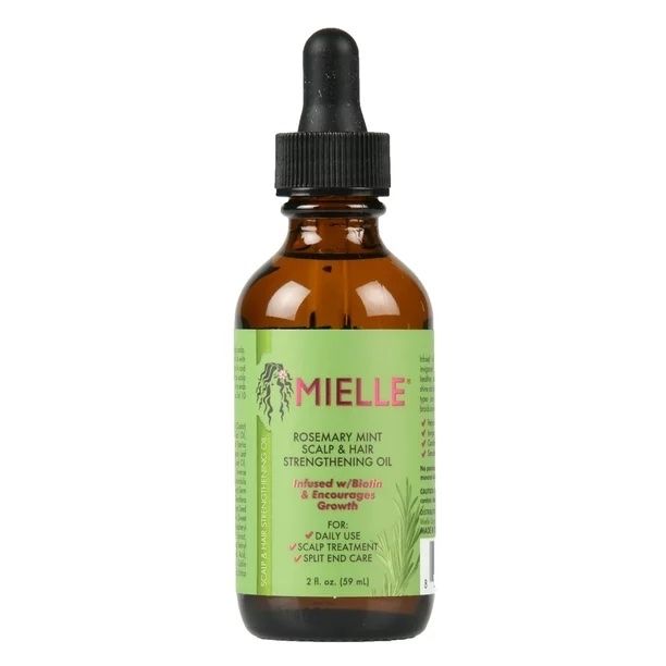 A green and brown jar of hair oil