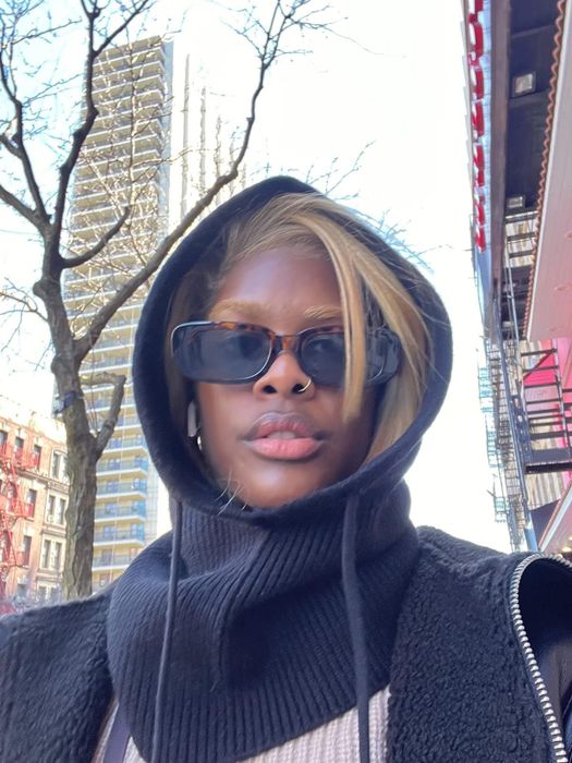 A reviewer rocking the black version of the hood.