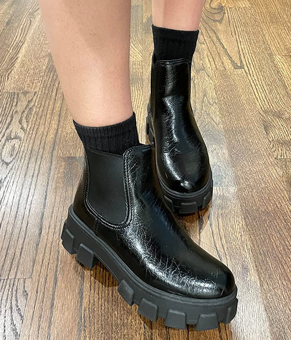 Close-up of a reviewer wearing the black boots