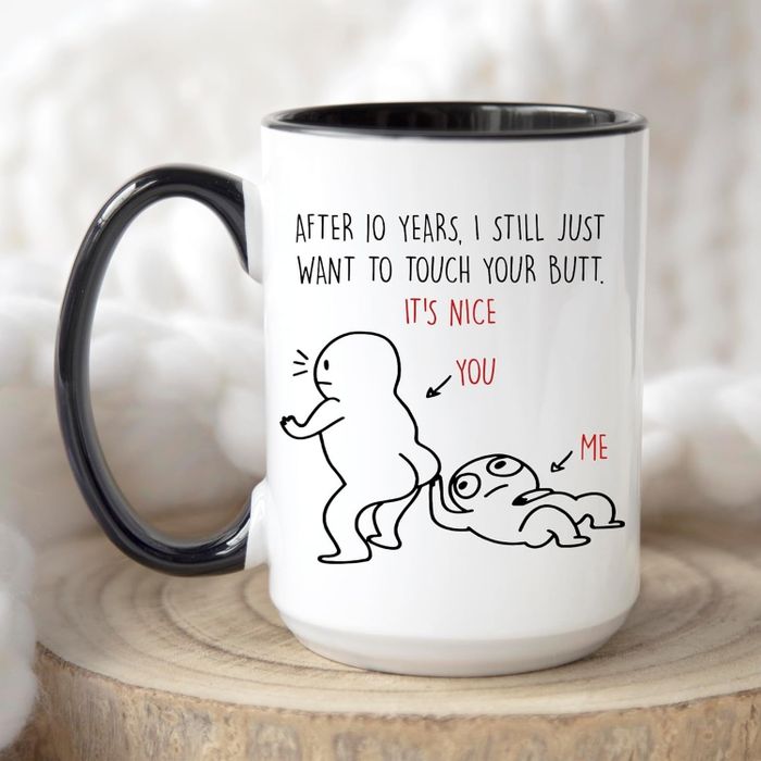 A white mug featuring the text: