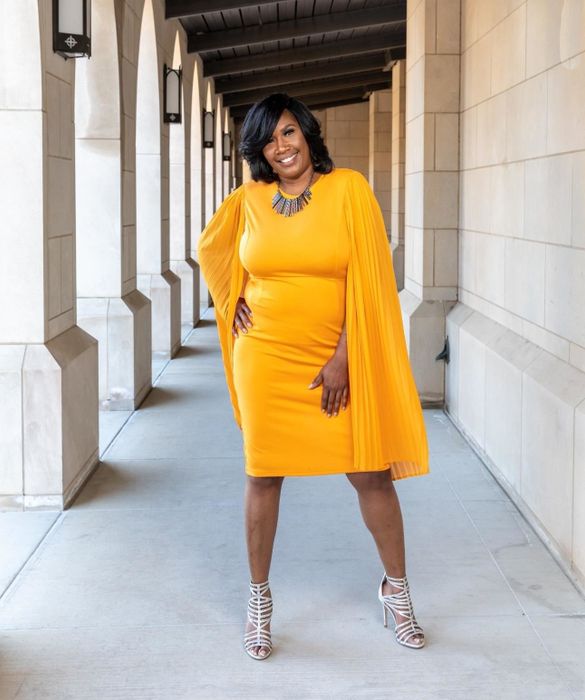 Reviewer wearing the dress in orange.