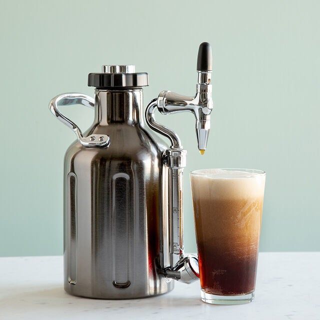 Stainless steel cold brew maker with a sleek, curved spout.