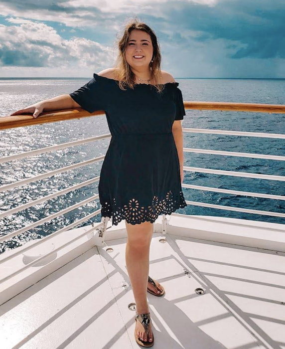 A reviewer in the black version of the dress