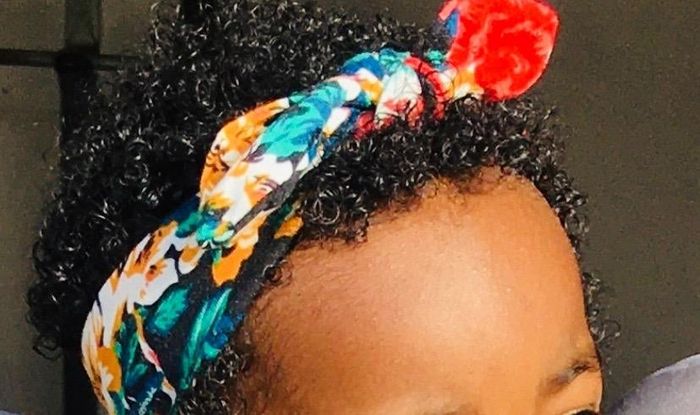 A reviewer's baby’s curls after using the moisturizer