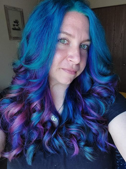 A reviewer's gorgeous purple and blue hair after using the dye