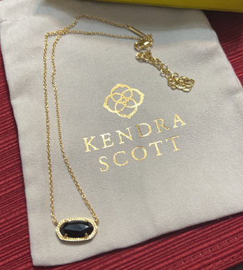A review image featuring the necklace