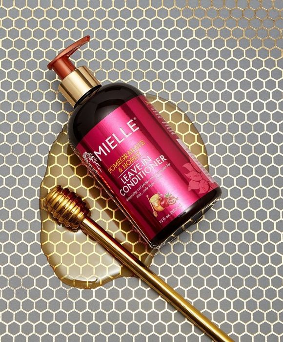 The leave-in conditioner surrounded by a puddle of honey