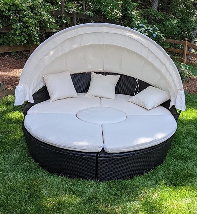 The daybed set up for a nap, with a canopy providing some cool shade