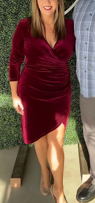 A reviewer wearing the dress in a rich wine red shade.