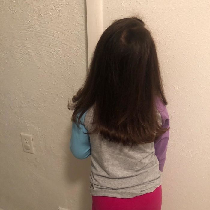 A reviewer's photo of their child with sleek, straightened hair after using the hot-air brush