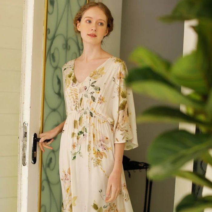 a model wearing an off-white floral print maxi dress