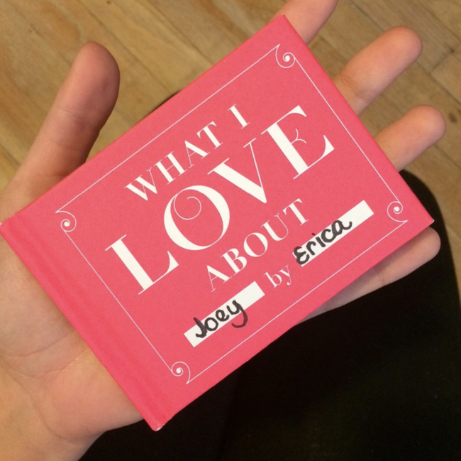 A reviewer holding the book with the title