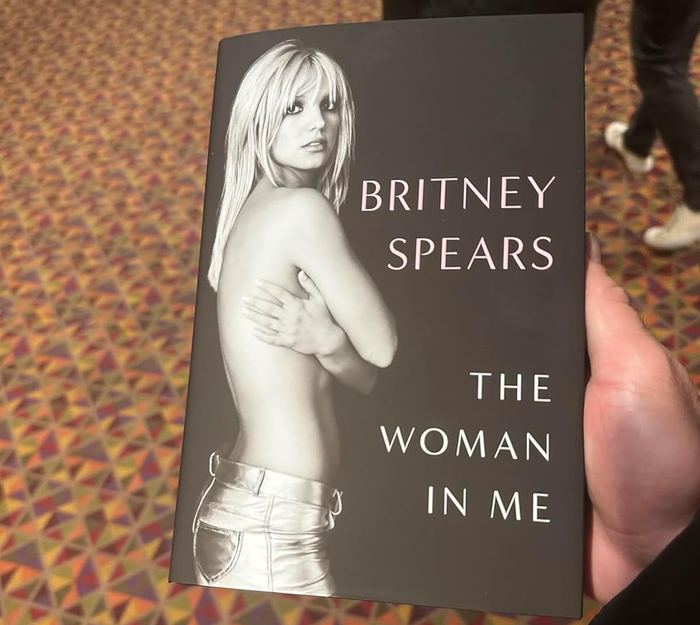 reviewer holding the book